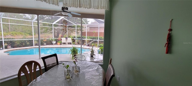 view of swimming pool with a lanai and a patio