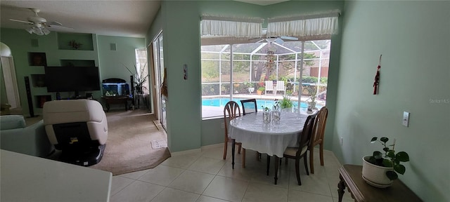 tiled dining room featuring ceiling fan