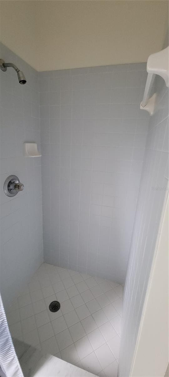 bathroom with a tile shower