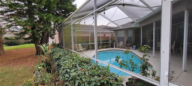 view of pool featuring a lanai and a patio