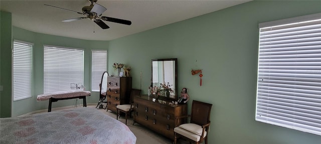 bedroom featuring ceiling fan and light colored carpet