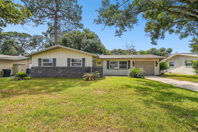 ranch-style home with a garage and a front yard