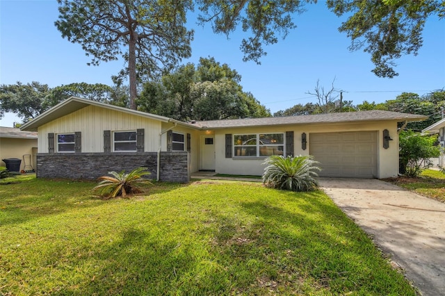 ranch-style home featuring a garage and a front yard