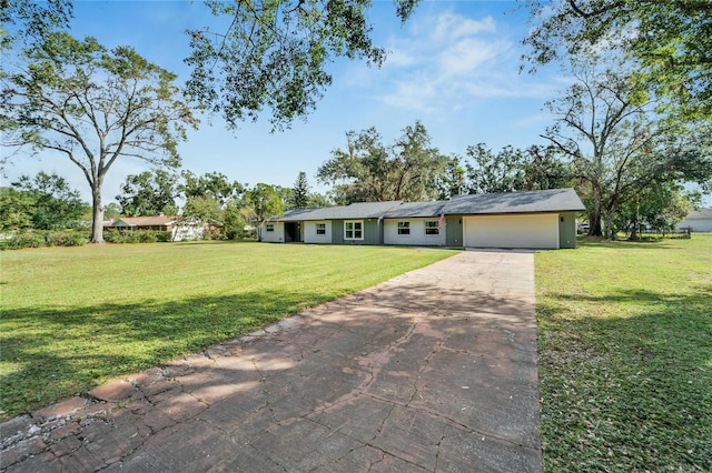 ranch-style house with a front lawn and a garage