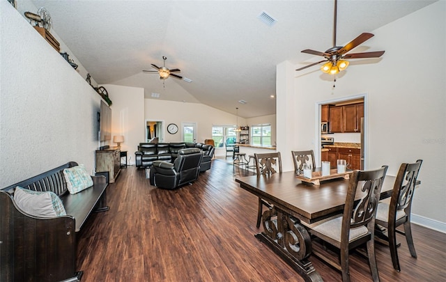 dining space featuring ceiling fan, a textured ceiling, lofted ceiling, and dark hardwood / wood-style floors