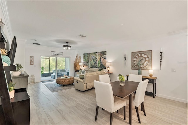 dining room featuring ornamental molding and ceiling fan