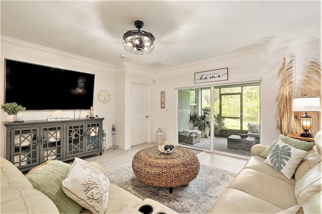 living room with light hardwood / wood-style flooring and ornamental molding