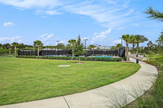 view of home's community with a lawn