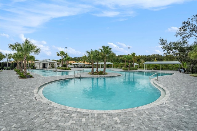 view of swimming pool featuring a patio area