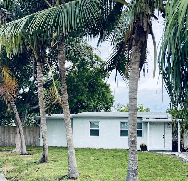 view of side of property with a yard