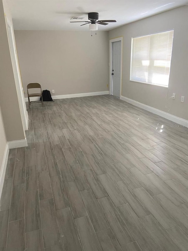 unfurnished room featuring wood-type flooring and ceiling fan