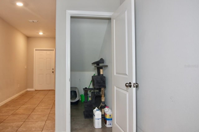 hallway featuring light tile patterned flooring