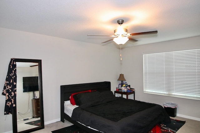 bedroom featuring ceiling fan and light colored carpet