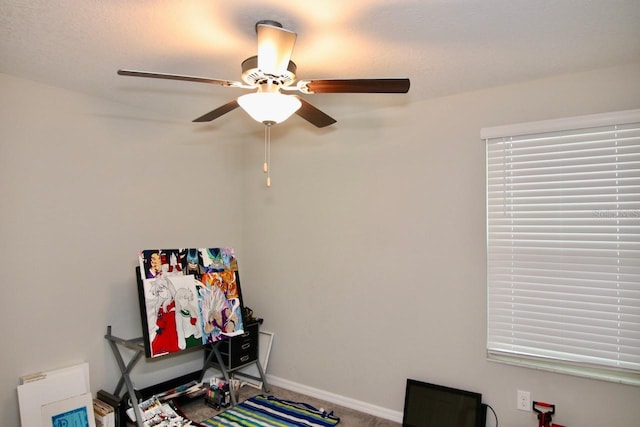 recreation room featuring carpet flooring and ceiling fan