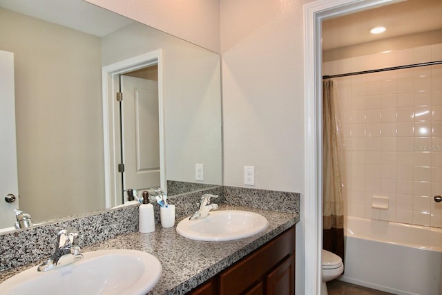 full bathroom featuring shower / tub combo, vanity, and toilet