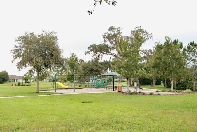 view of community with a playground and a yard