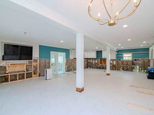 living area with recessed lighting, ornamental molding, and a notable chandelier