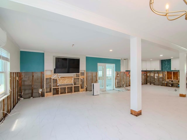 living area featuring recessed lighting and an inviting chandelier