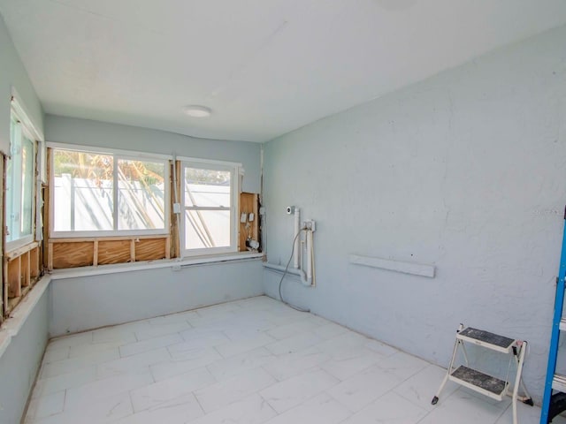 interior space featuring marble finish floor