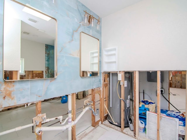 interior space featuring water heater and visible vents