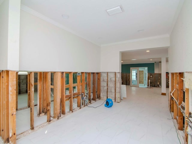 empty room featuring ornamental molding and visible vents