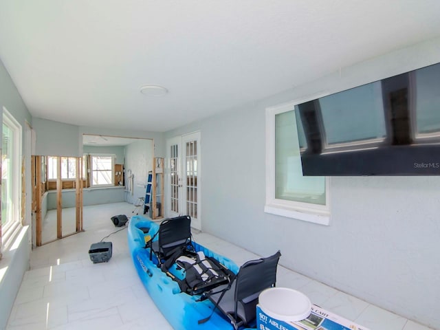 sunroom featuring french doors
