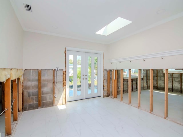 interior space featuring a skylight, french doors, visible vents, and crown molding