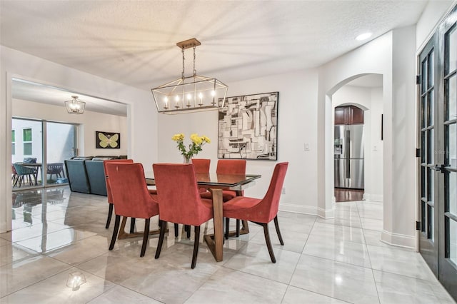 dining room featuring a textured ceiling