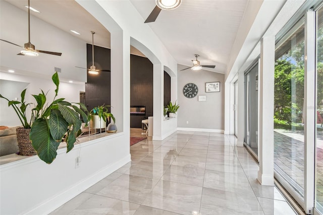 entrance foyer with vaulted ceiling and ceiling fan