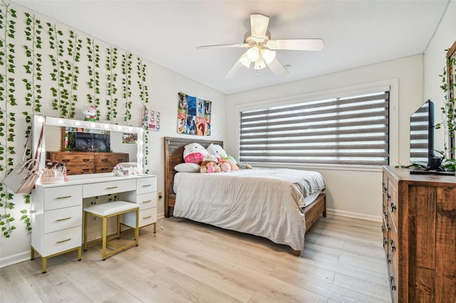 bedroom featuring light hardwood / wood-style flooring and ceiling fan