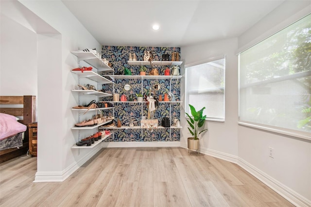 spacious closet featuring light hardwood / wood-style floors