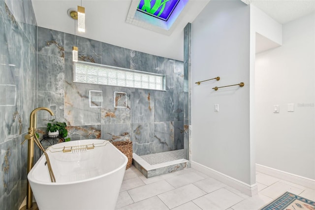 bathroom featuring tile walls, tile patterned flooring, and plus walk in shower