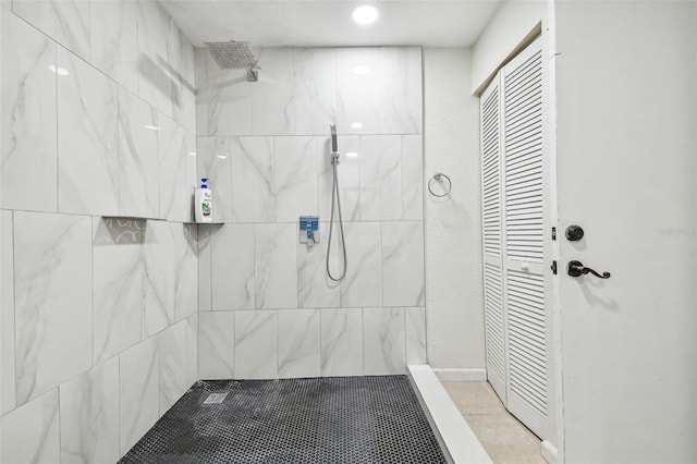 bathroom with a tile shower