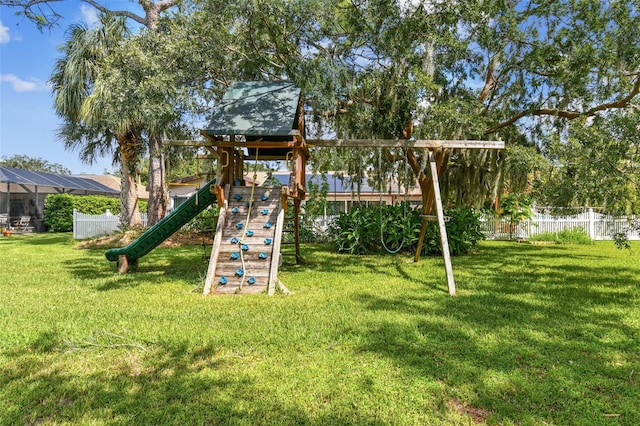 view of jungle gym with a lawn