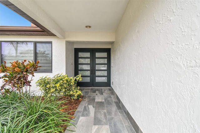 entrance to property featuring french doors