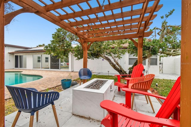 view of patio with a fenced in pool, a pergola, and an outdoor fire pit