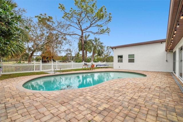 view of swimming pool featuring a patio