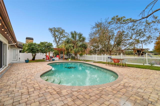 view of swimming pool featuring a pergola and a patio area