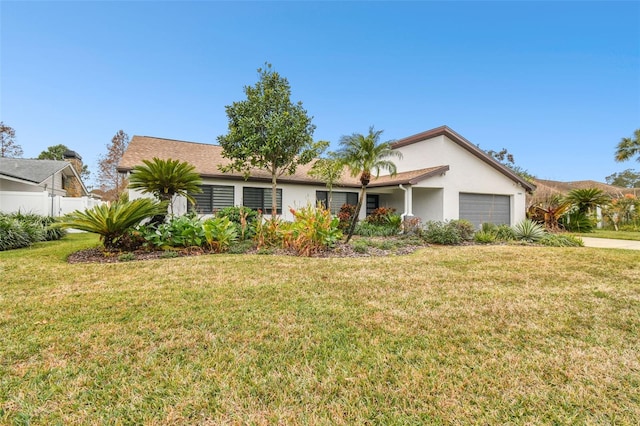 ranch-style home with a garage and a front yard