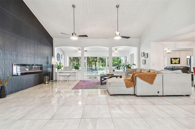 living room featuring lofted ceiling, wood ceiling, and ceiling fan