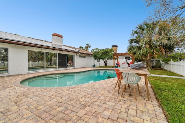 view of swimming pool featuring a pergola and a patio