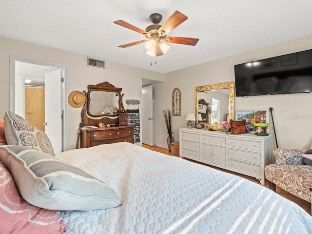 bedroom featuring ceiling fan and hardwood / wood-style floors