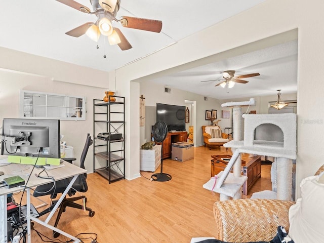 office area featuring ceiling fan and light hardwood / wood-style floors