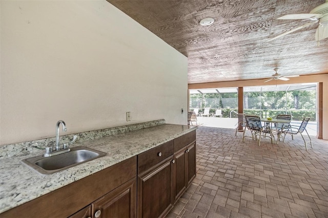 view of patio with sink and ceiling fan