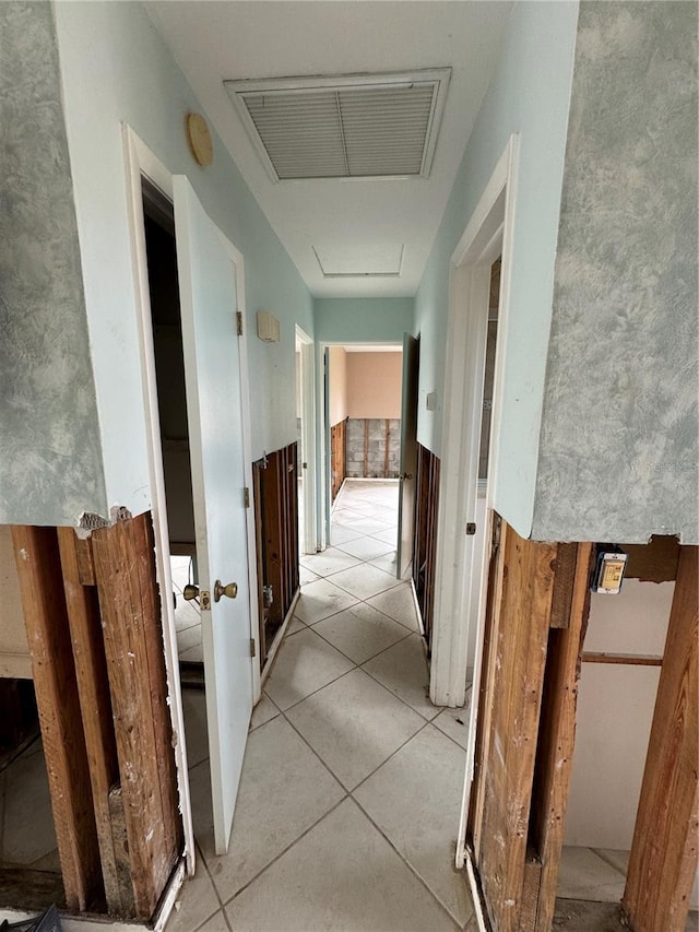 hall with light tile patterned flooring