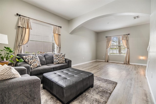 living room with light hardwood / wood-style flooring