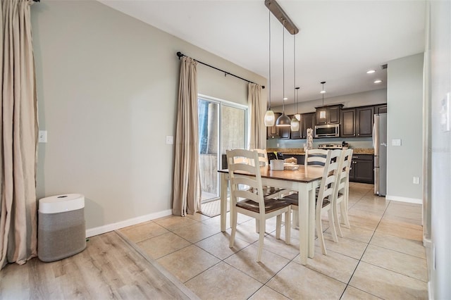 dining room with light hardwood / wood-style flooring