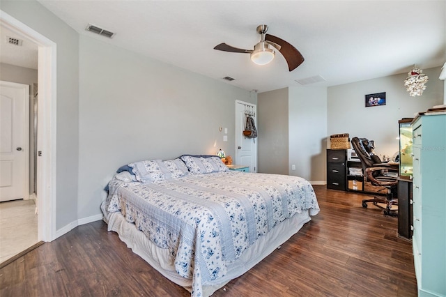 bedroom featuring ceiling fan, a closet, and dark hardwood / wood-style flooring