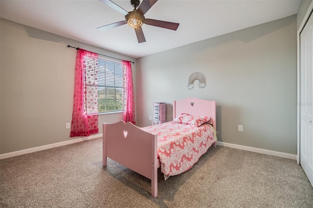 bedroom with carpet, ceiling fan, and a closet