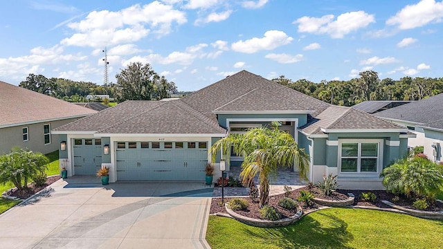 view of front of property featuring a garage and a front yard